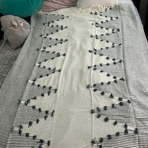 A boho-themed throw blanket is a stylish and cozy addition to your home decor. - Picture 1 of 3